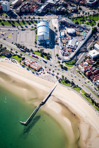 Aerial view of Luna Park and St Kilda foreshore on a sunny day. - Australian Stock Image