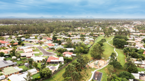 aerial view of Moreton Bay suburbs looking towards the Glasshouse Mountains - Australian Stock Image