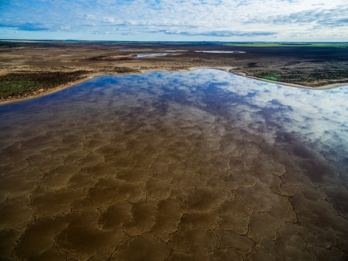 aerial view of patterns in a salt lake in farmland