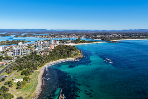 Aerial view of Pebbly Beach in Forster, showcasing its unique rocky shoreline - Australian Stock Image