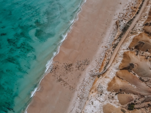 Aerial view of Port Willunga Beach - Old Jetty and walkway and stairs to beach from above - Australian Stock Image