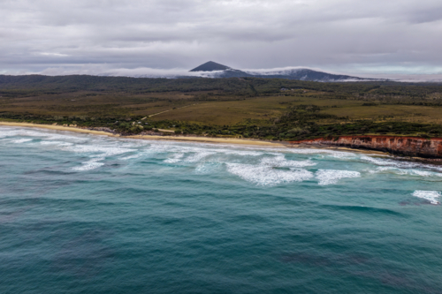 Aerial view of Red Cliff Campground and the surrounding coastal landscape - Australian Stock Image
