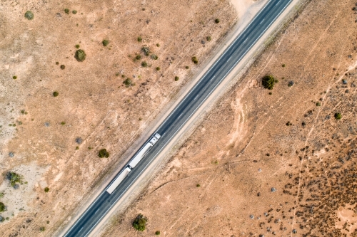 Aerial view of road train truck on Eyre Highway along the Nullarbor Plain