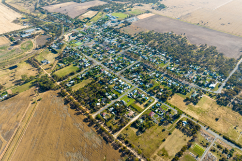 Aerial view of Rupanyup township surrounded by dry farmland and open plains. - Australian Stock Image
