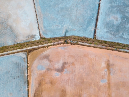 Aerial view of salt evaporation ponds of various shapes - Australian Stock Image