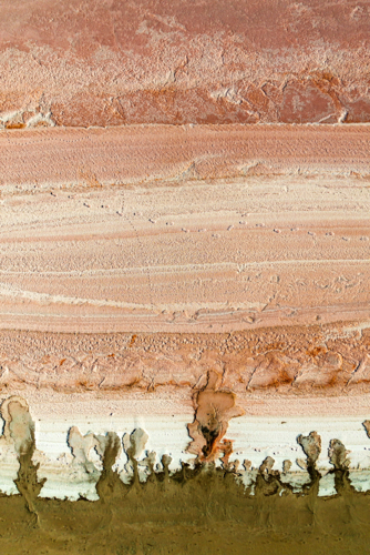 Aerial view of salt textures and mineral bands in warm earthy tones - Australian Stock Image