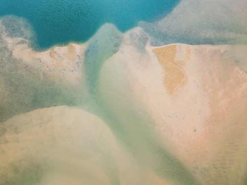 Aerial view of sand and water patterns of a tidal estuary