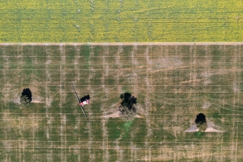 Aerial view of spraying on farm - Australian Stock Image