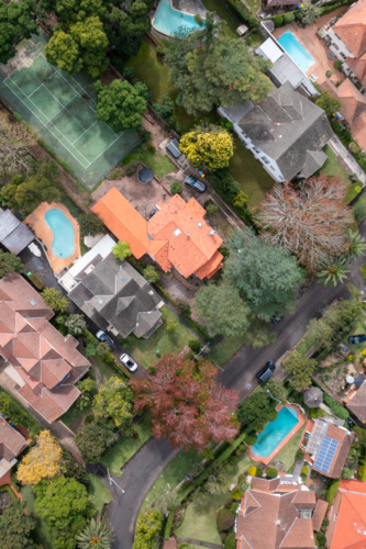Aerial View of Suburban Neighbourhood with Homes and Green Spaces - Australian Stock Image