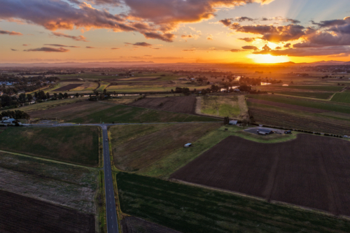 Aerial view of sunset over farmland at Morpeth - Australian Stock Image