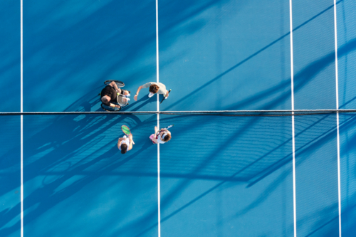 aerial view of tennis court with 4 players - Australian Stock Image