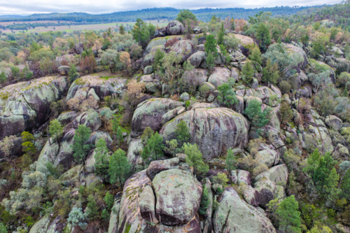 Aerial view of the dramatic granite rock formations and natural landscape at Cranky Rock Reserve - Australian Stock Image