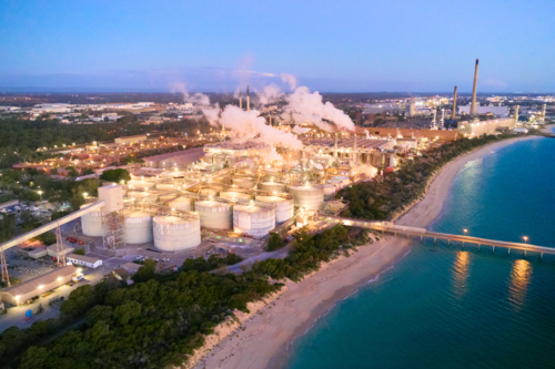 Aerial view of the oceanside Kwinana Alumina Refinery and adjacent power station at dusk. - Australian Stock Image