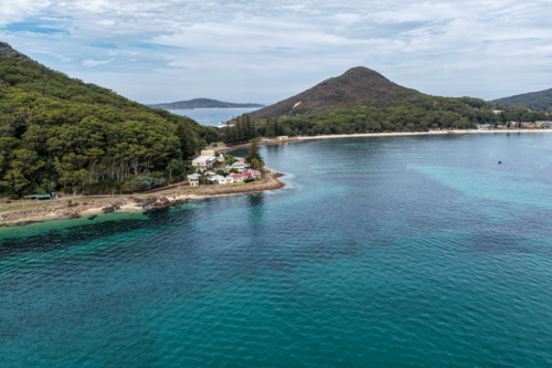 Aerial view of Tomaree Lodge and ocean at Shoal Bay in Port Stephens, New South Wales, Australia. - Australian Stock Image