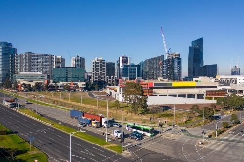 Aerial view of traffic stopped at a busy city intersections and high rise buildings behind - Australian Stock Image