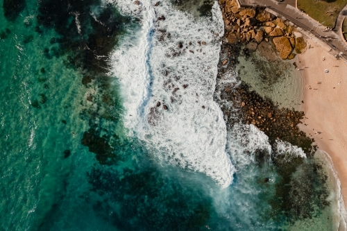 Aerial view of waves crashing into the Bogey Hole at Bronte Beach