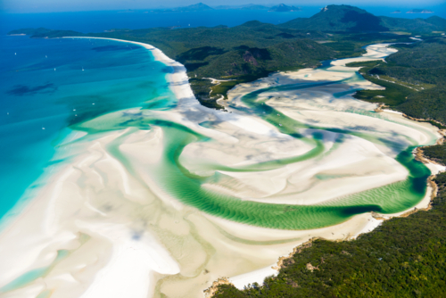 Aerial view of white sands and vivid green tidal channels at Hill Inlet, Whitsundays - Australian Stock Image