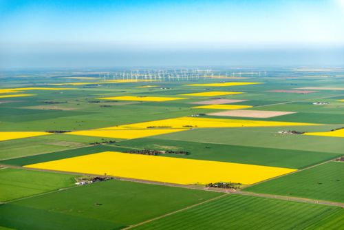 Aerial view of wind turbines and patchwork farmland - Australian Stock Image