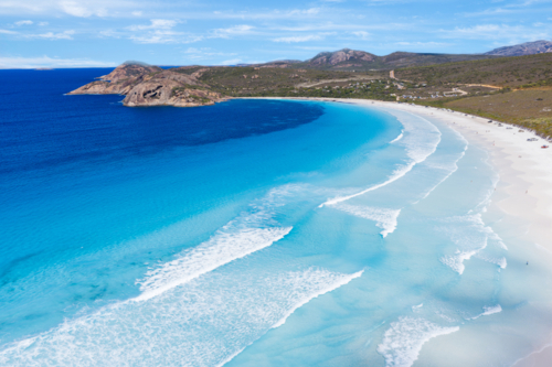 Aerial view over the stunning blue ocean and white sandy beach of Lucky Bay Esperance - Australian Stock Image