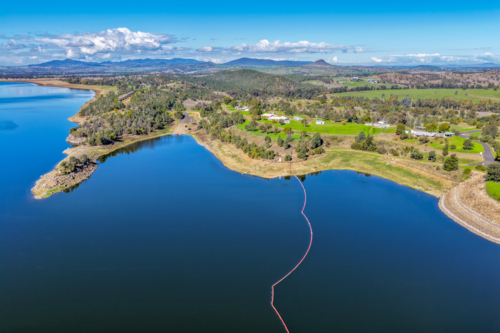 Aerial view showcasing the Lake Keepit boat ramp, shoreline and surrounding landscape - Australian Stock Image