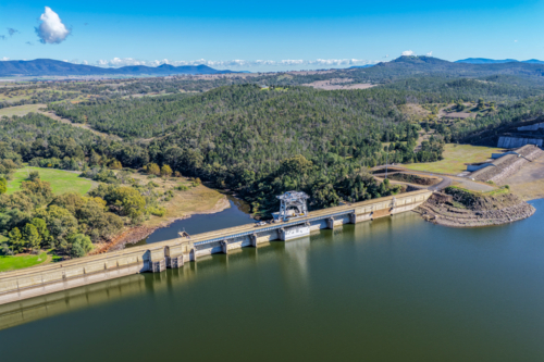 Aerial view showcasing the Lake Keepit dam wall and surrounding rural landscape - Australian Stock Image
