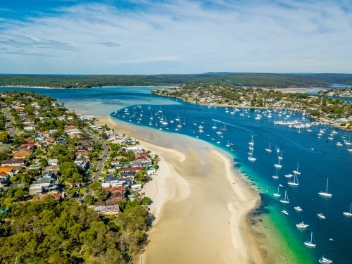 Aerial views of Gunnamatta beach and water views with the many luxury yachts and boats moored - Australian Stock Image