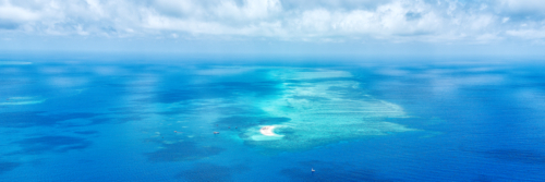Aerial Views Over The Coral Sea Sand Great Barrier Reef Sand Atoll - Australian Stock Image