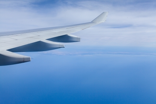 Aeroplane wing over ocean on Sydney to Perth flight