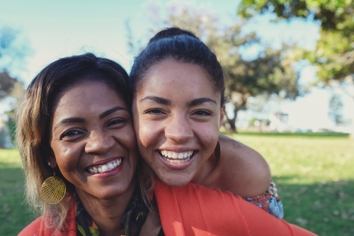 African mother and multicultural teen daughter - Australian Stock Image