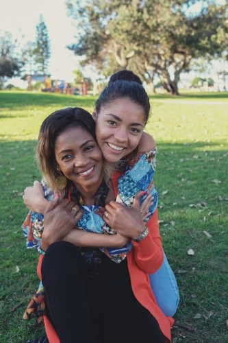 African mother and multicultural teen daughter - Australian Stock Image