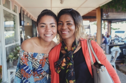 African mother and multicultural teen daughter - Australian Stock Image