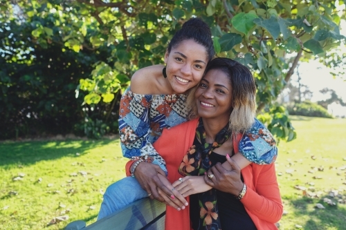 African mother and multicultural teen daughter - Australian Stock Image