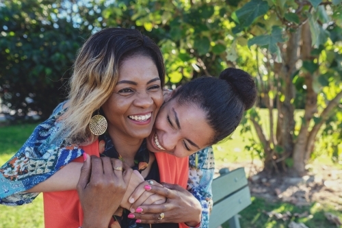African mother and multicultural teen daughter - Australian Stock Image