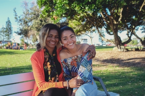 African mother and multicultural teen daughter - Australian Stock Image