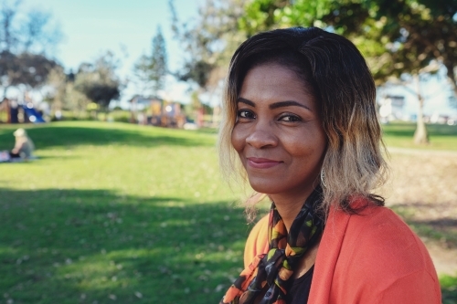 African woman in the park - Australian Stock Image