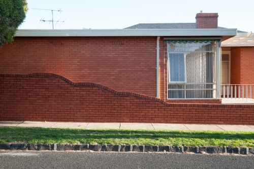 Afternoon sunlight on a retro brick home