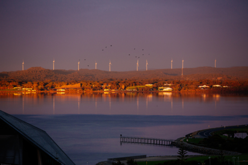 Albany Wind farm reflecting in the water of Princess Royal Harbour - Australian Stock Image
