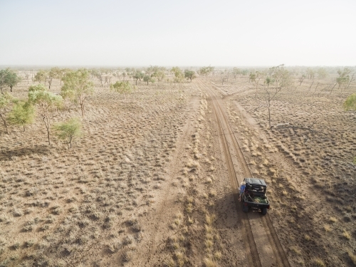 All terrain vehicle on outback road - Australian Stock Image