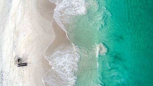 An aerial shot of a fisherman trying his luck in the ocean - Australian Stock Image