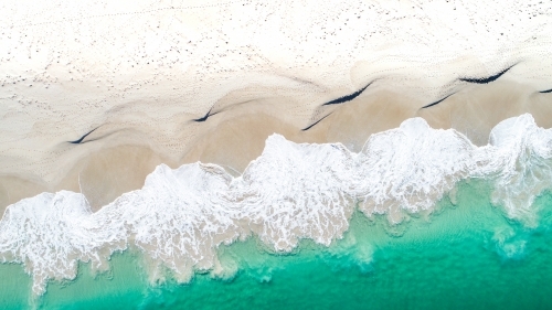 An aerial shot of the aftermath of a crashing wave - Australian Stock Image