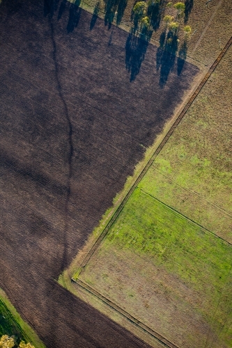 An aerial view of the land and paddocks early in the morning in Ipswich. Queensland, Australia. - Australian Stock Image