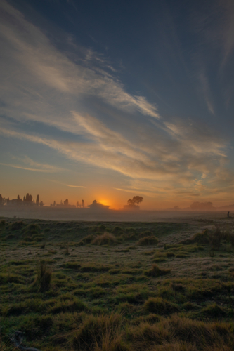 An early misty morning in the country under a cloudy sky - Australian Stock Image
