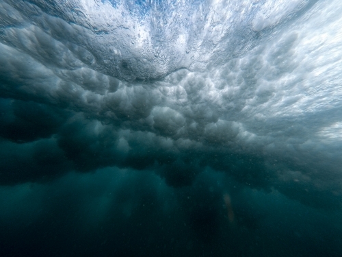 An explosion from under a crashing wave - Australian Stock Image