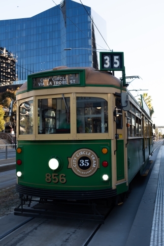 An historic W-Class 1930's green and yellow city circle tram in Melbourne Australia - Australian Stock Image