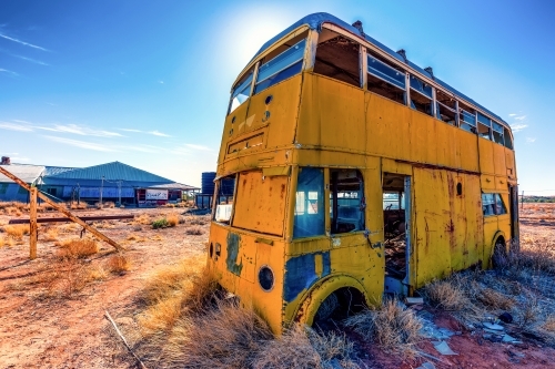 An old dilapidated double decker bus outside the Betoota Hotel - Australian Stock Image