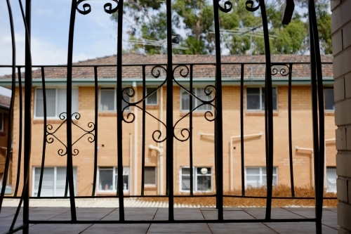 An old fashioned walkway in front of an apartment block - Australian Stock Image