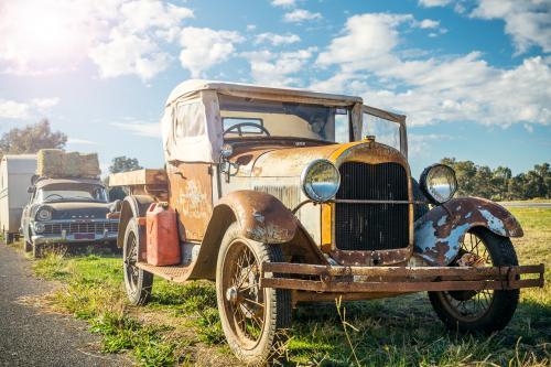 An vintage Ford car parked on the roadside