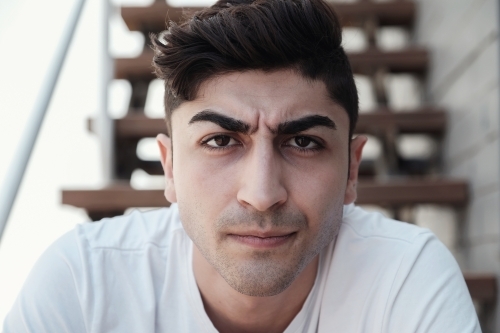 Angry multicultural young adult man - Australian Stock Image