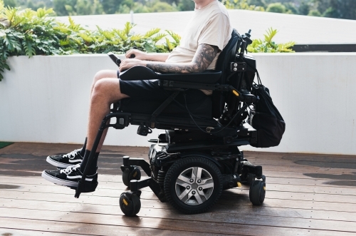 anonymous man in wheelchair