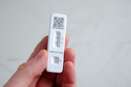 Antigen rapid test kit showing a positive result - Australian Stock Image